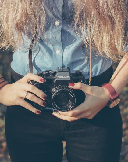 Woman with vintage retro camera