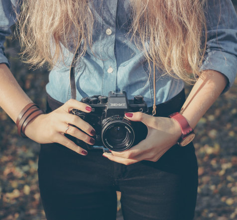 Woman with vintage retro camera