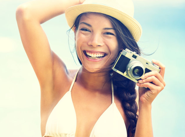 Beach woman with vintage retro camera